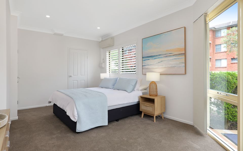Downstairs queen bedroom with powder room