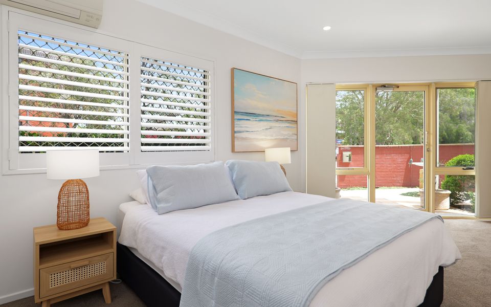 Downstairs queen bedroom with powder room