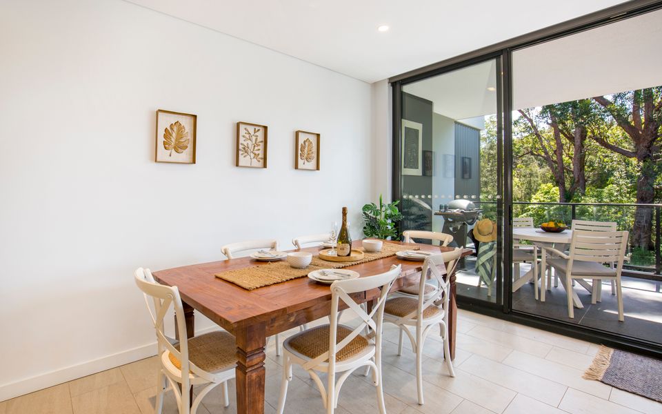 Latitude South Coast - huskisson accommodation dining room table with balcony and outdoor view