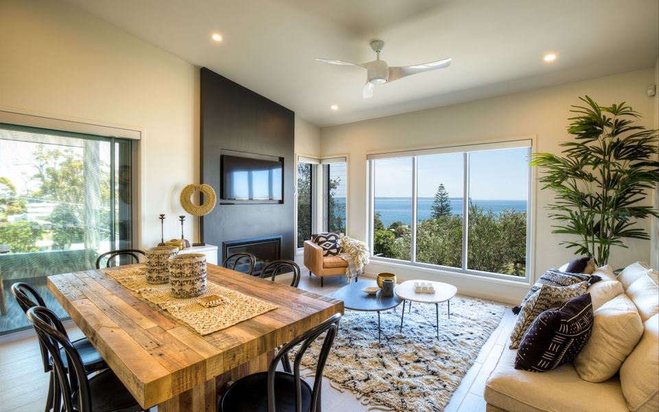 Dining an living room ocean views at hyams beach accommodation