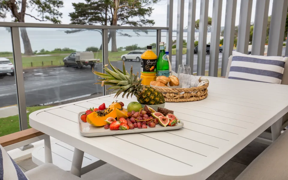Latitude South Coast - jervis bay holiday rentals balcony with dining set and water views