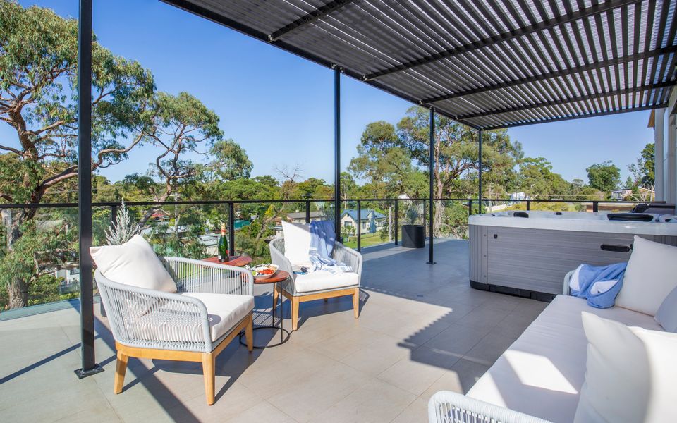Latitude South Coast - south coast accommodation balcony with seating and outdoor spa