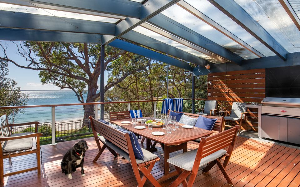 Latitude South Coast - vincentia pet friendly accommodation outdoor dining table with barbeque with beachfront views