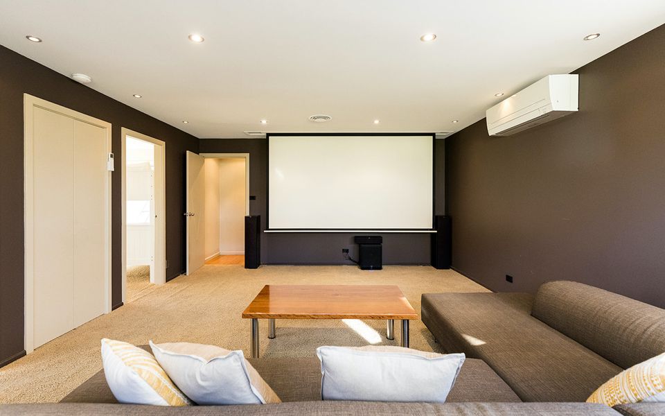 Latitude South Coast - pet friendly accommodation nsw theater room with projector