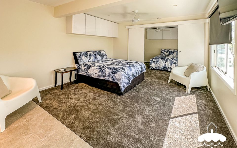 Downstairs bedrooms separated by sliding doors