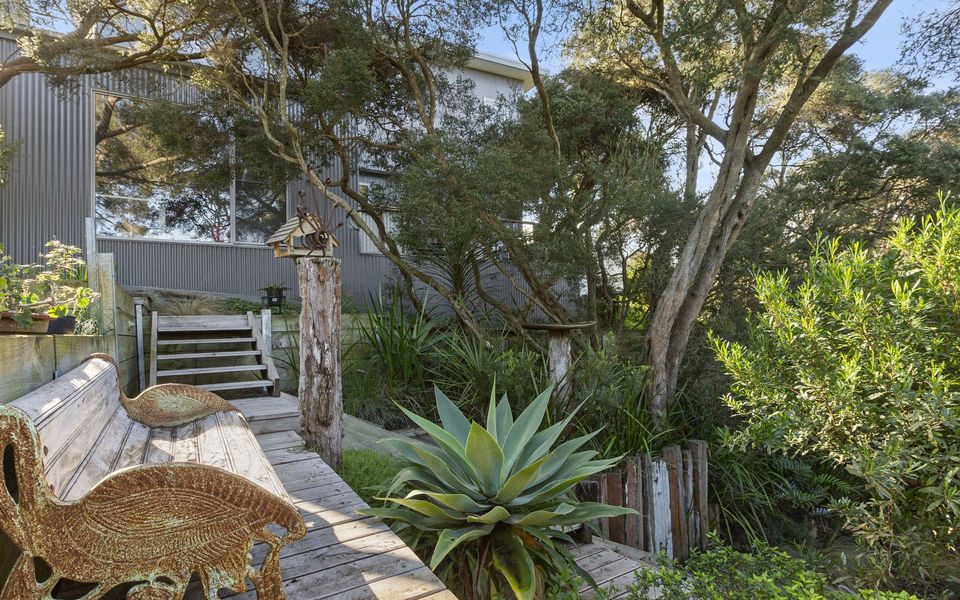 Fully landscaped back garden including veggie patch and fruit tress.