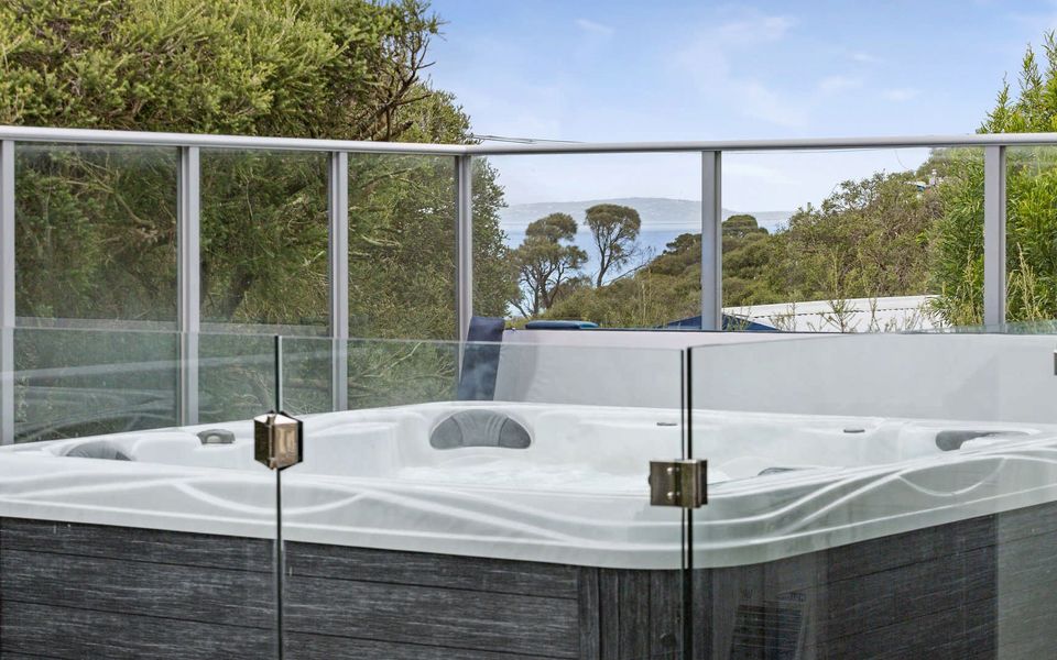 Heated spa with bay views.