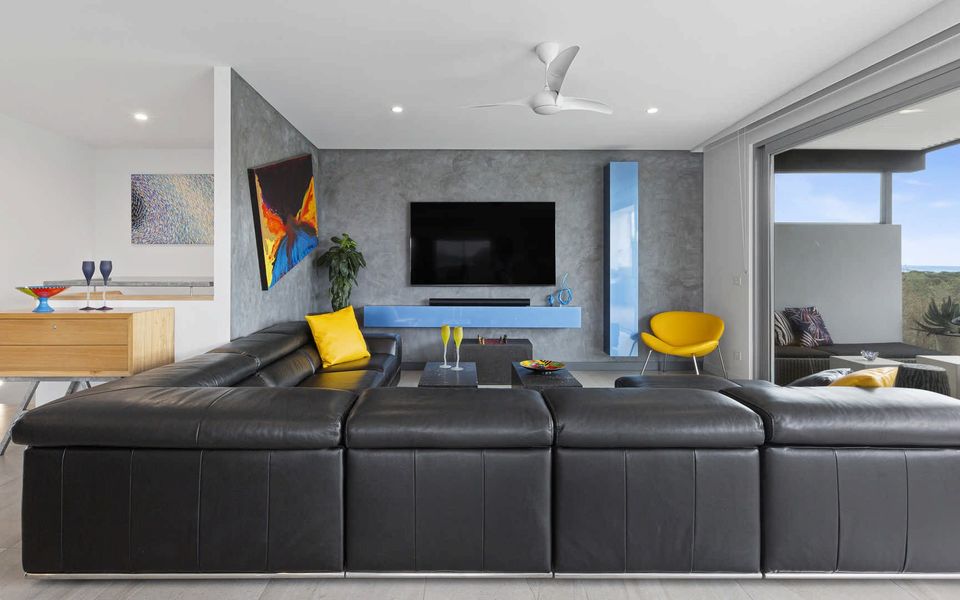 Living room with TV and surround sound.