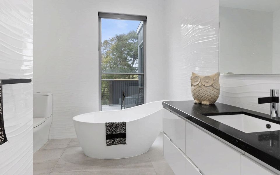 Family bathroom located on the ground floor with bath and shower.