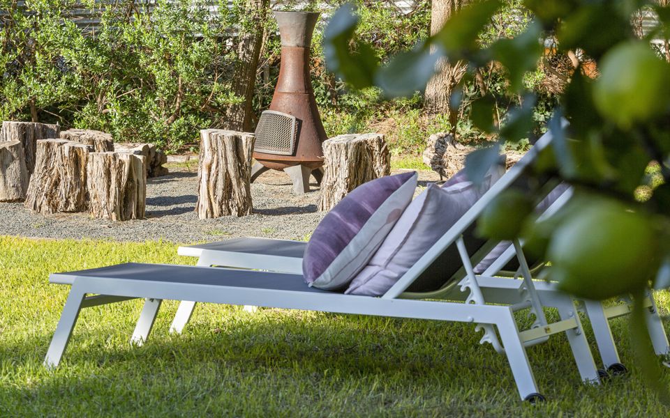 Outdoor Chiminea and sun loungers