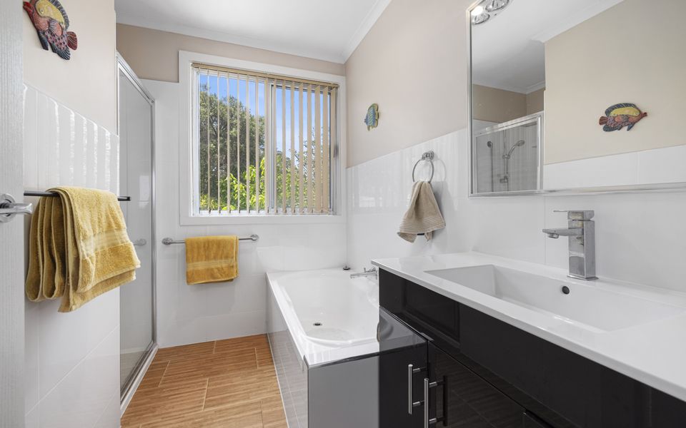 Family bathroom on first floor with bath and separate shower