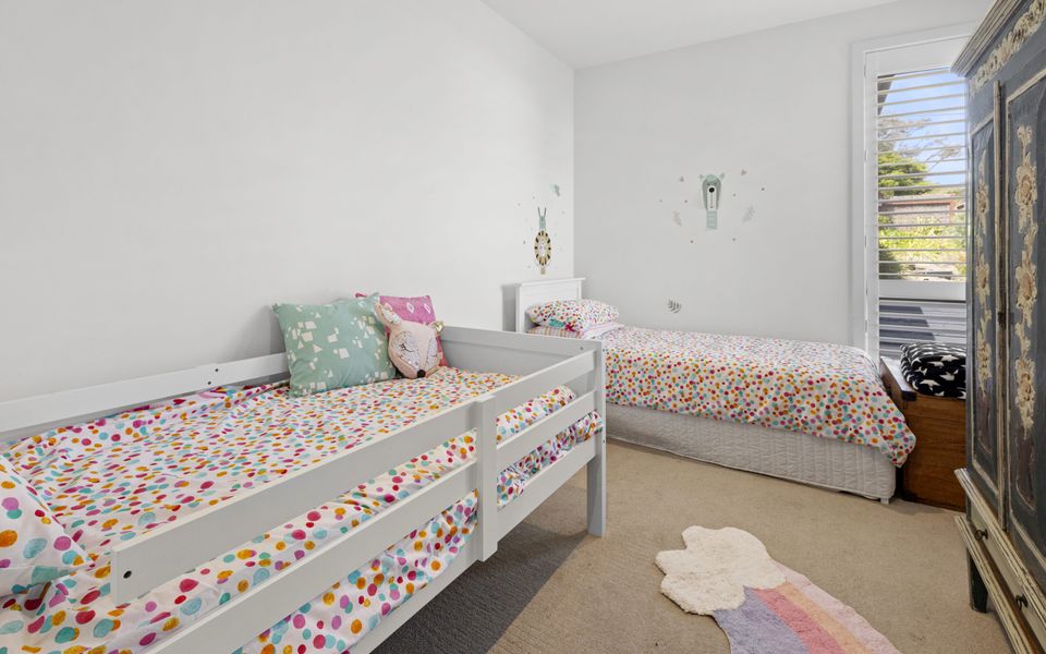 Bedroom 4 with two single beds and a spare single mattress with bedding