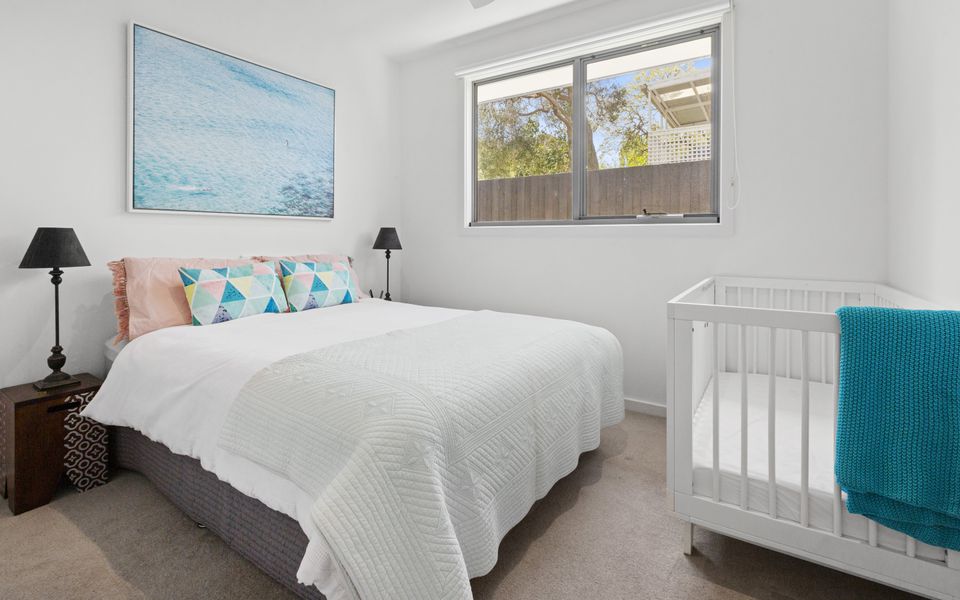 Bedroom 2 with queen bed and a cot
