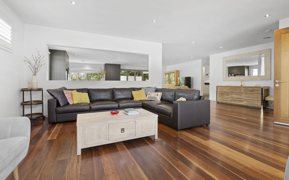 Second living area with gas log fire and comfy King Leather couches
