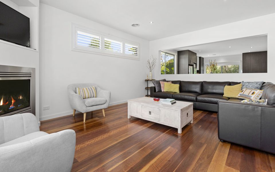 Second living area with gas log fire and comfy King Leather couches