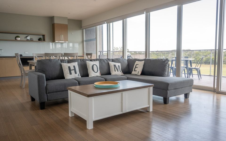 Open plan living dining/kitchen area with access to the outdoor deck