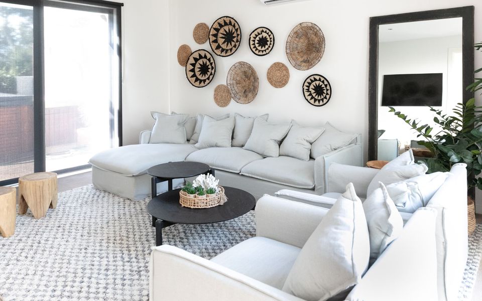 Living area with TV and access to the spa and outdoor entertaining areas.