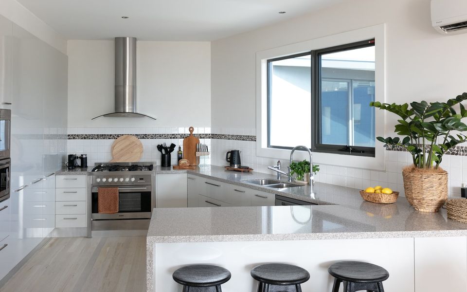 Kitchen with breakfast bar and stools
