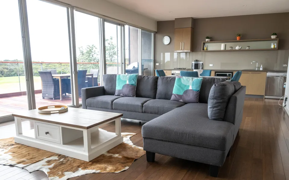 Open plan living with access to the outdoor deck on the upper level.