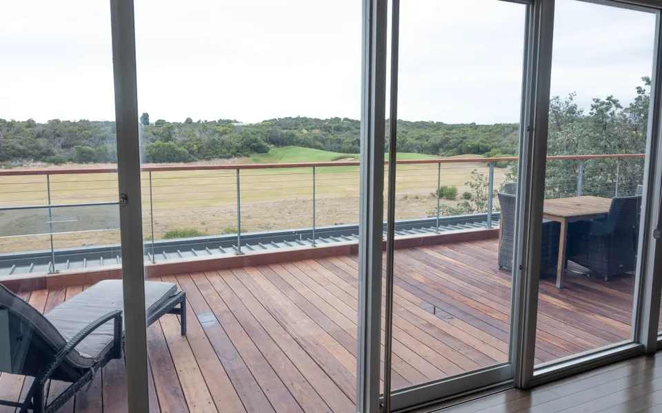 Access via patio sliding doors from living area onto the deck.