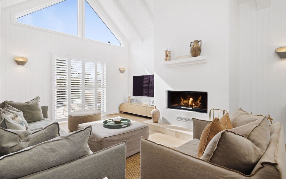 Family living room with ornamental fire place and comfy couches