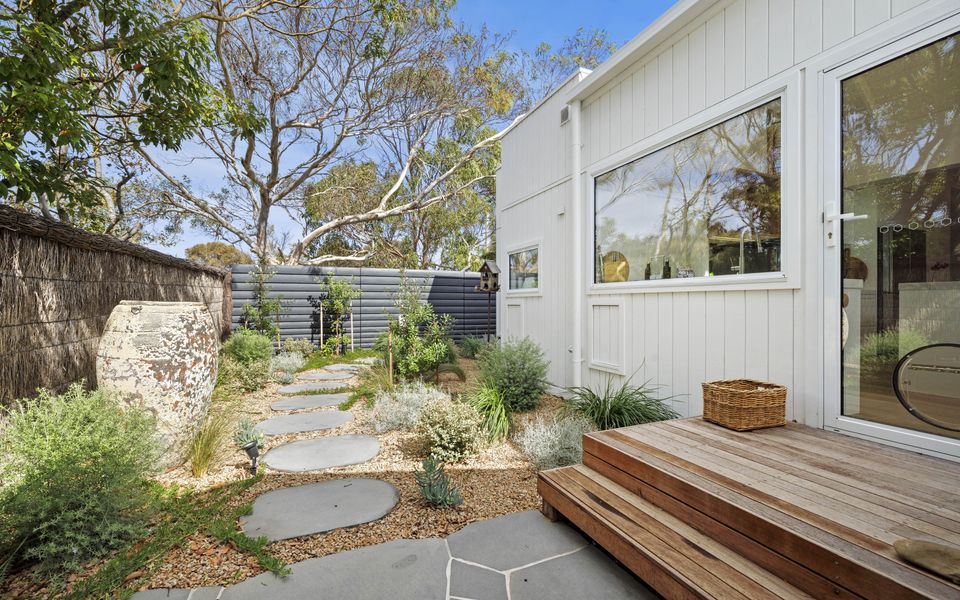 Access from the kitchen to the side garden and undercover BBQ area