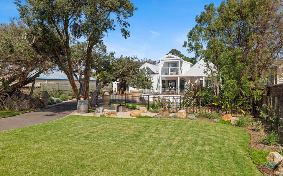 Large lawn area, fully fenced with long driveway