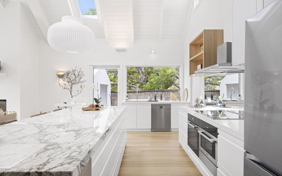 Kitchen with marble bench top and stainless steel appliances