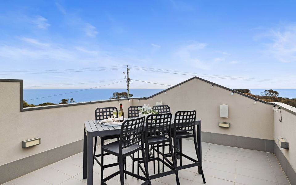 The rooftop terrace, with bar-style seating, offers views that stretch across the bay to the Bellarine Peninsula and Melbourne’s city skyline.