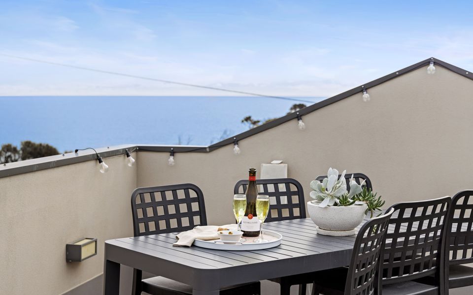 The rooftop terrace, with bar-style seating, offers views that stretch across the bay to the Bellarine Peninsula and Melbourne’s city skyline.