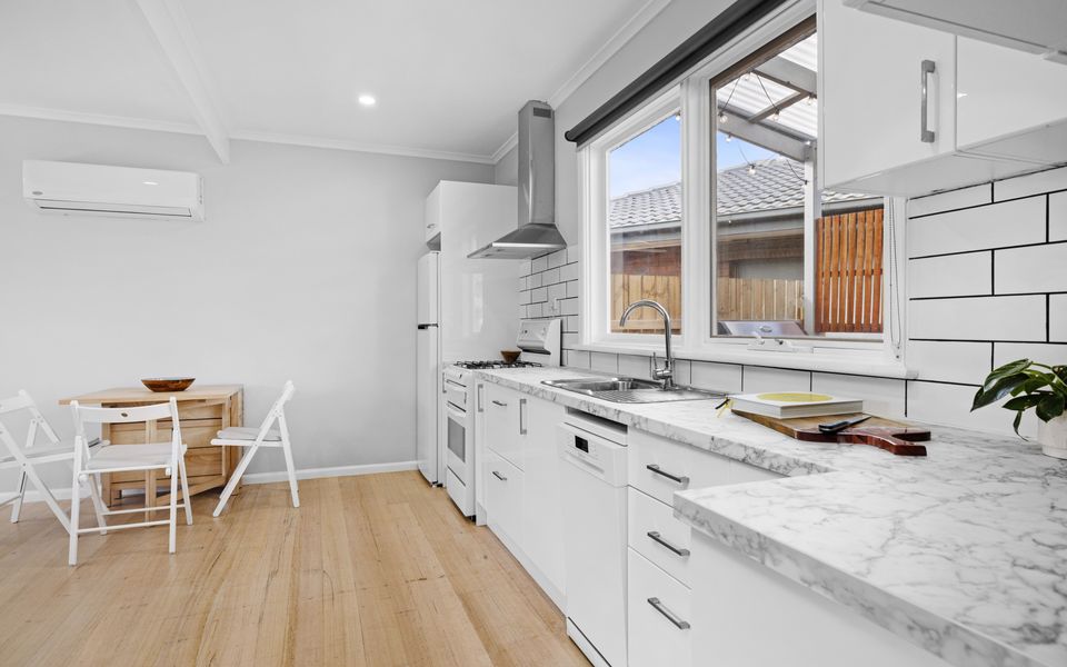 Open plan kitchen dining area with dining table that extends