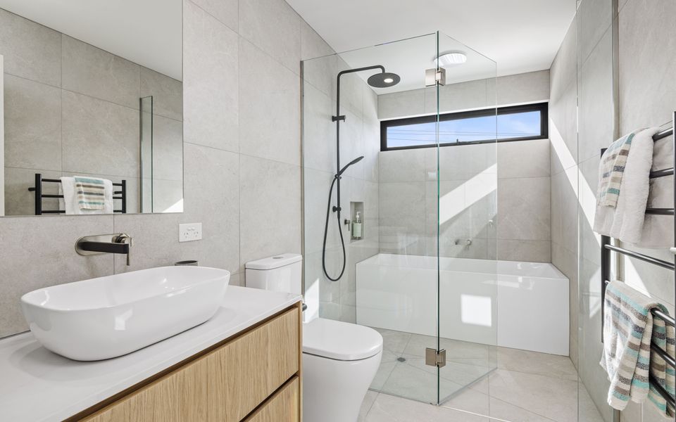 Family Bathroom on the top floor featuring a bath, shower, toilet and vanity.