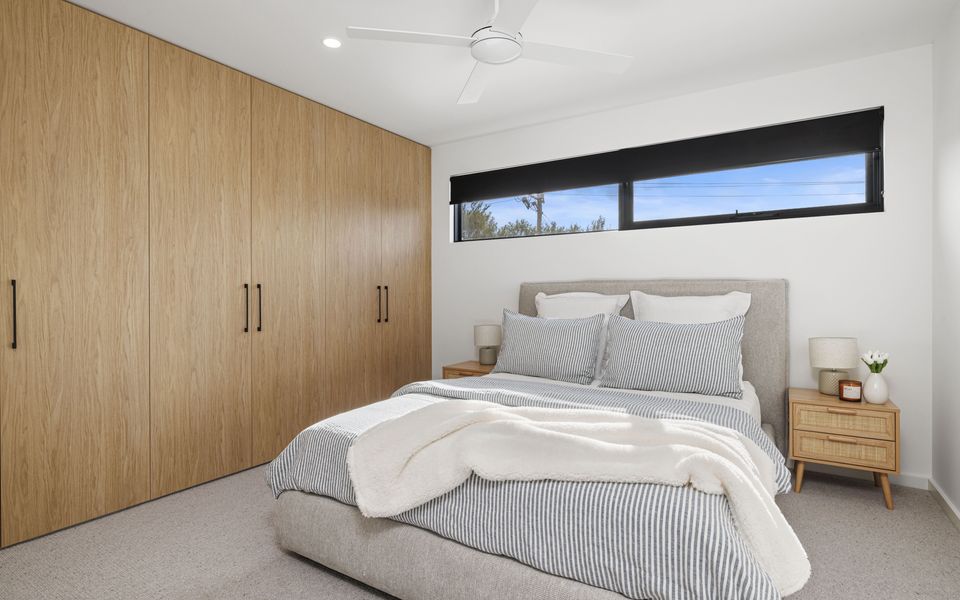 Bedroom three with split system, ceiling fan and Queen Bed