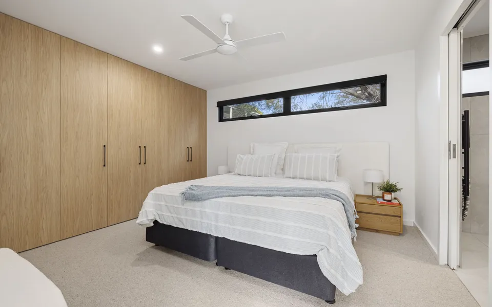 Lower-ground bedroom with flexible bedding setup (king or king singles) and its own ensuite.