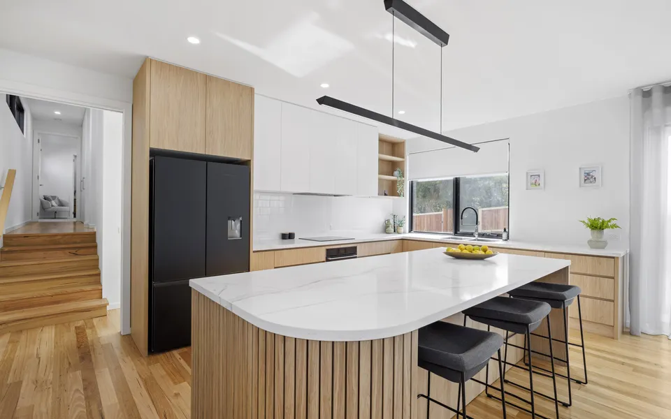 Beautiful open-plan kitchen with timber island bench, induction cooktop, butler’s pantry, and everything you need for easy holiday cooking.