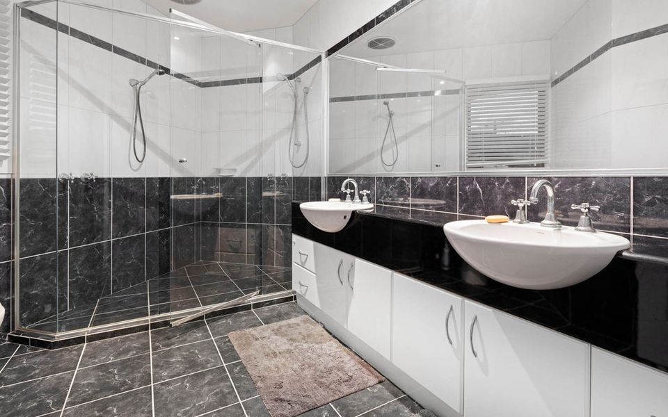Large ensuite to master bedroom, complete with shower, toilet and two basins. Towels are supplied.