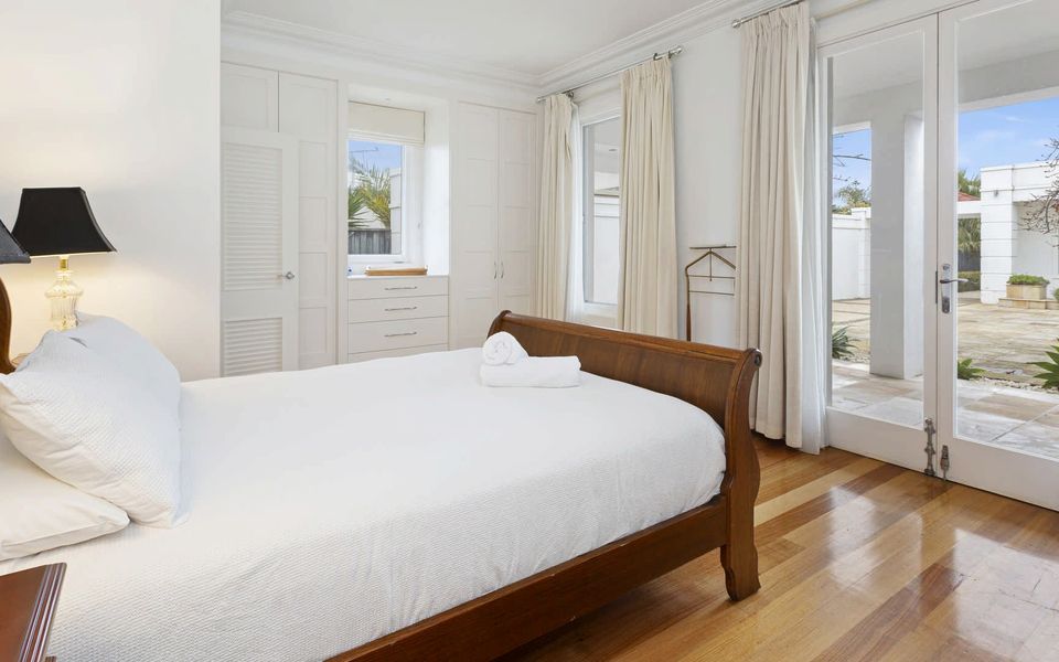 Master Bedroom with Queen bed and doors opening on to the courtyard