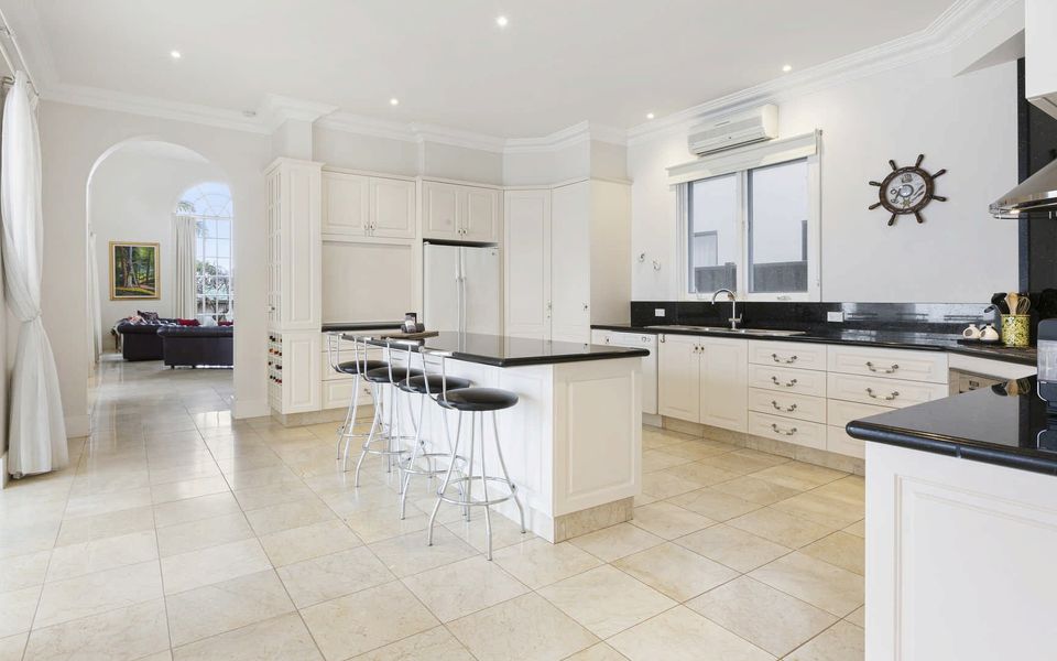 Generous kitchen with breakfast bar seating for four and plenty of crockery and cutlery supplied.