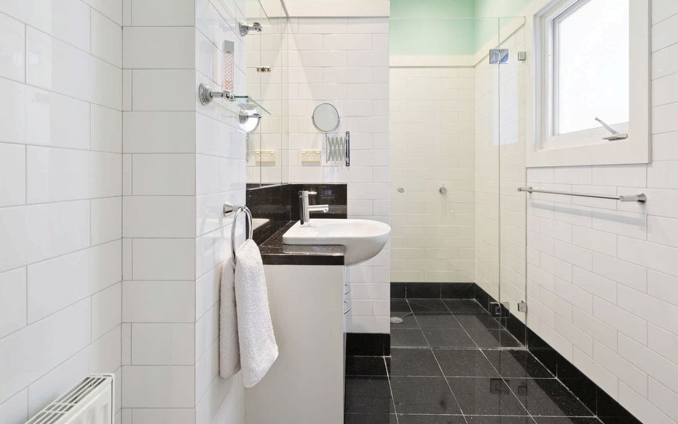 Ensuite to master bedroom with shower, vanity and toilet.