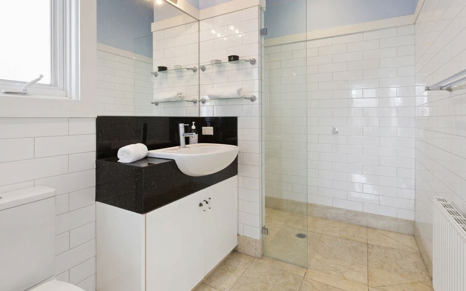 Guest house ensuite, complete with shower, vanity and toilet.