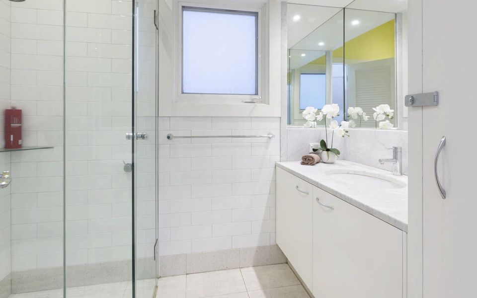 Second family bathroom with shower, vanity and toilet