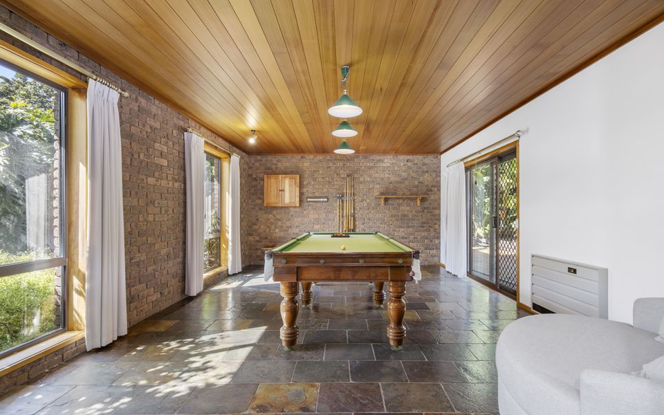 Billiard room with easy access to the pool area