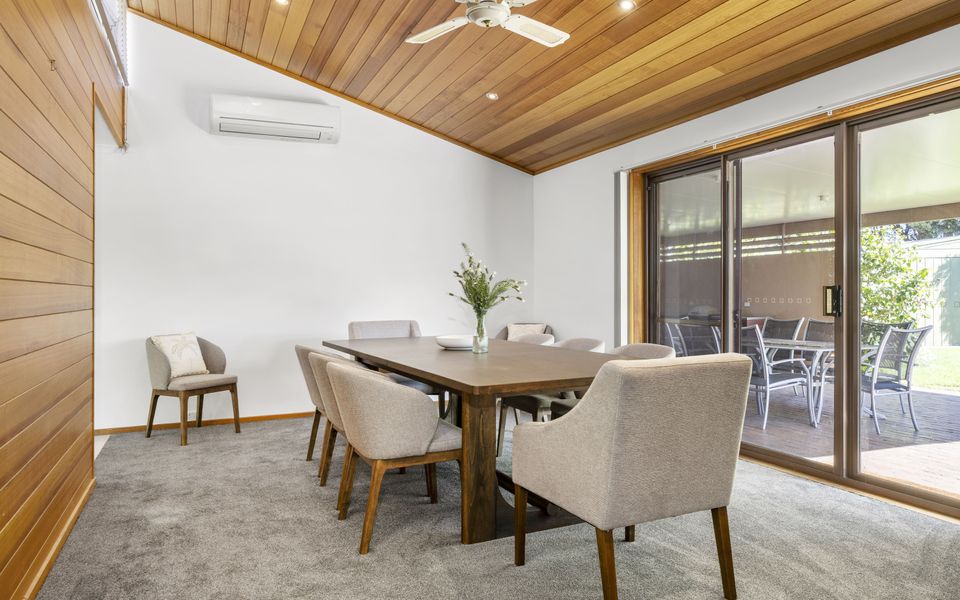 Light filled dining area with seating for 10