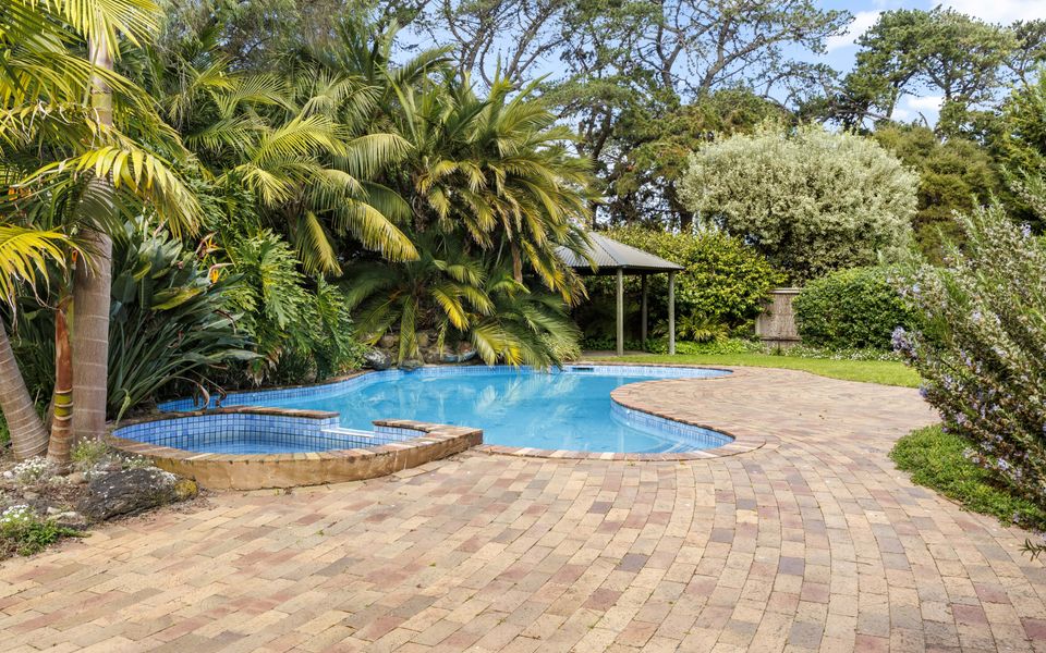 Enjoy the heated pool and spa, fully fenced and accessible from the kitchen and billiard room.