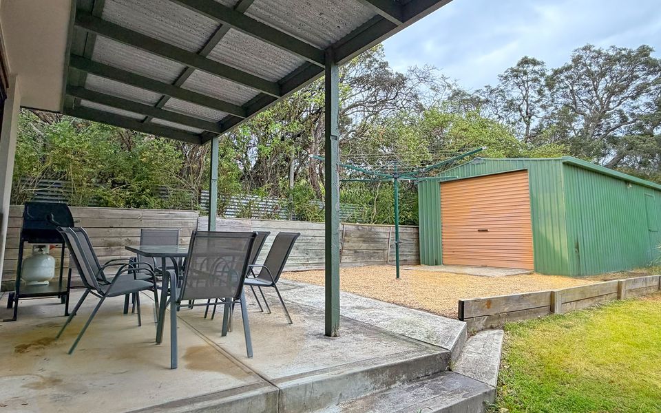 Undercover entertaining area complete with BBQ and outdoor setting