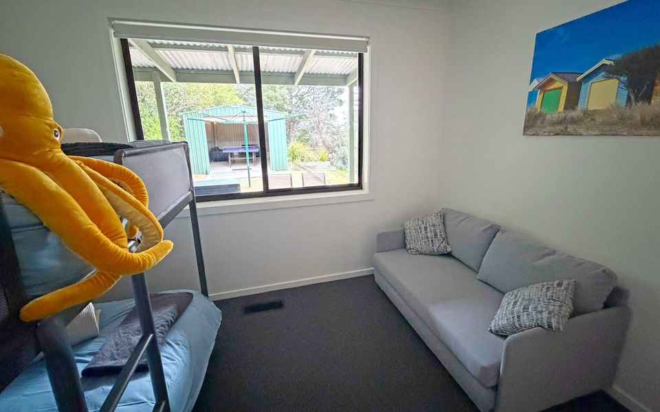 Bedroom three features a bunk bed, sofa bed (available on request when booking), and ducted heating for comfort.