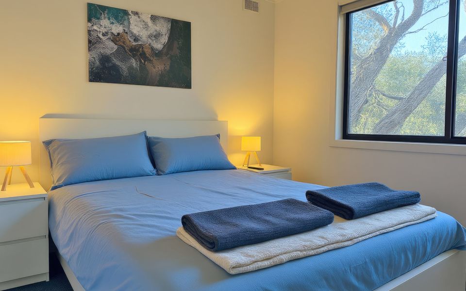 Master bedroom with Queen bed, smart TV, robes and ducted heating