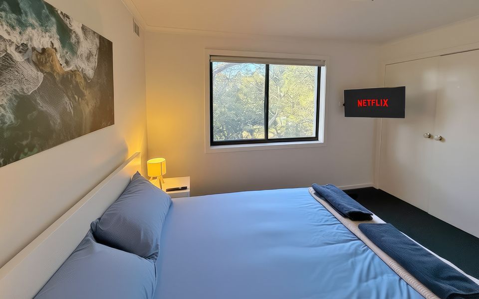 Master bedroom with Queen bed, smart TV, robes and ducted heating