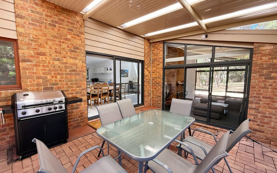 Relax or dine outdoors under cover, with seating for six and a gas BBQ