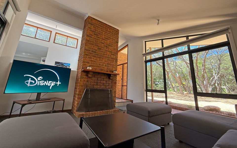 Relaxing living area with ornamental fireplace and smart TV